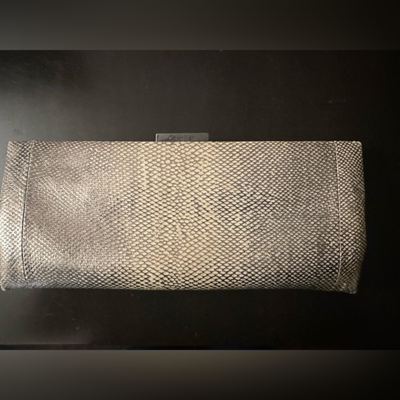 Calvin Klein Handbags - Slim Calvin Klein silver snake print clutch